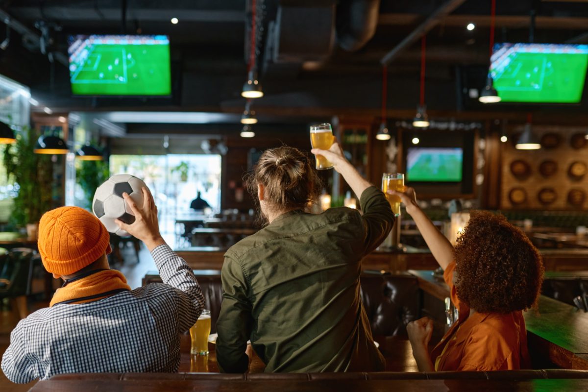 A fan reacting to a goal at one of the sports bars in Tokyo showing a live World Cup match