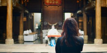 A woman in the audience watches a full Kabuki program at the Kabukiza theatre in Ginza, Tokyo