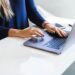 woman-working-laptop-unsplash - TOKYOwebzine A foreign professional secures a co-working desk in a modern Shibuya shared office space