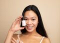 A woman applying lightweight serum as part of her humid skin care morning routine in Tokyo