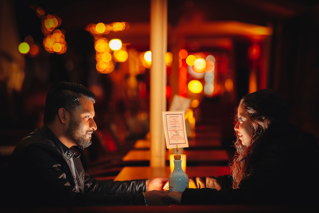 A couple sits together inside a Tokyo listening bar, immersed in kissa culture and the sound of vintage speakers