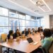 entrepreneur-in-office-meeting-unsplash - TOKYOwebzine A foreign founder and Japanese business partner reviewing plans in a Tokyo startup office