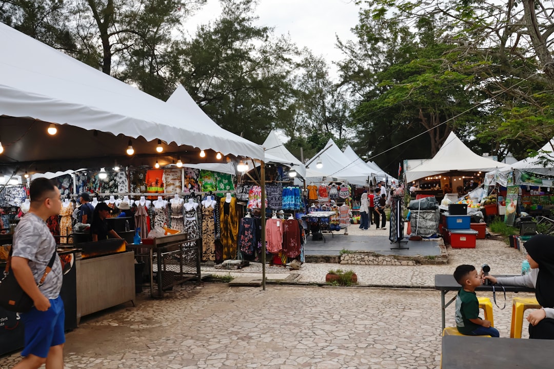 Visitors browse vendors at an outdoor flea market, a key part of the Tokyo secondhand shopping circuit