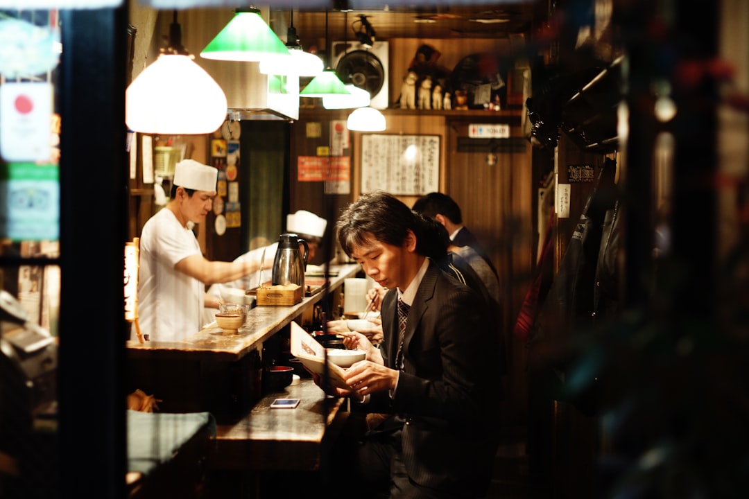 Visitors eating at a food court inside one of Tokyo's underground malls on a hot summer day