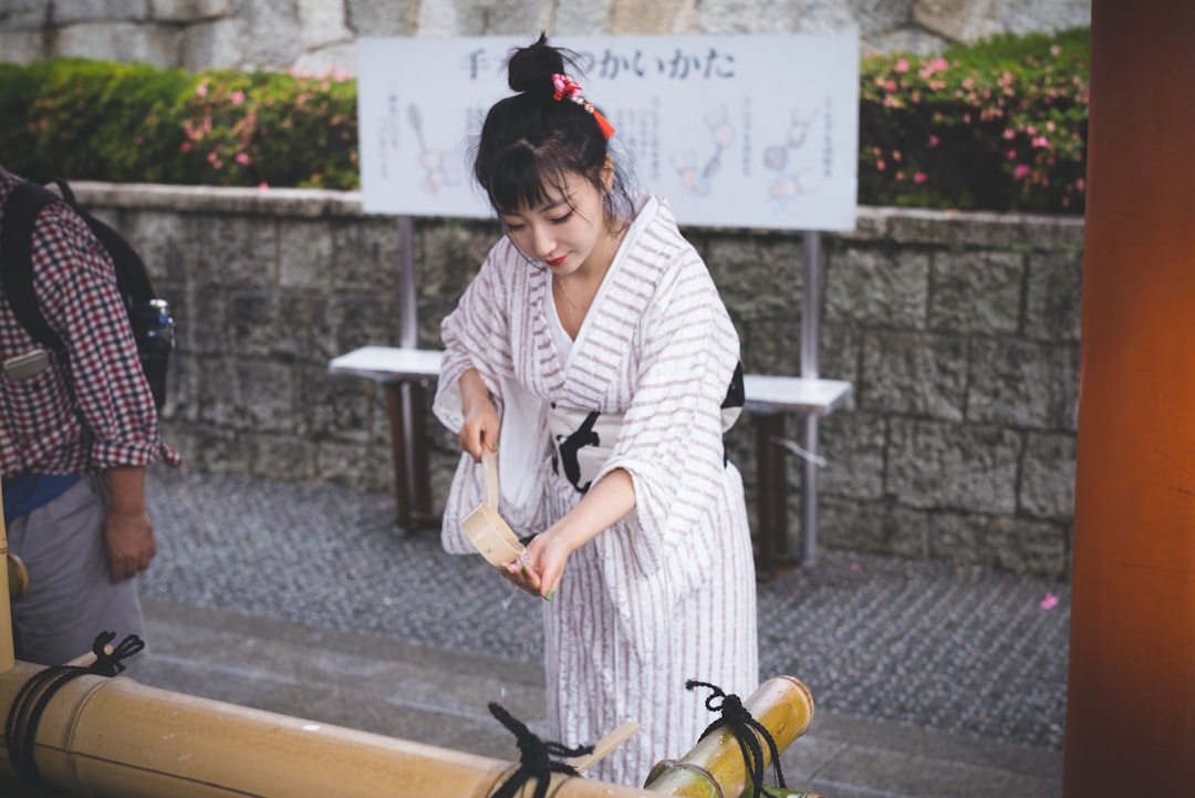 A woman resting quietly after a cold water session at a Tokyo sento bathhouse