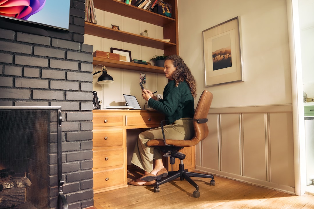 A woman reviews her summer electricity bill at her Tokyo apartment desk,