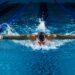 woman-swimming-laps-indoor-pool-morning-unsplash - TOKYOwebzine A woman swimming laps in a Tokyo public pool as part of her cold water morning routine