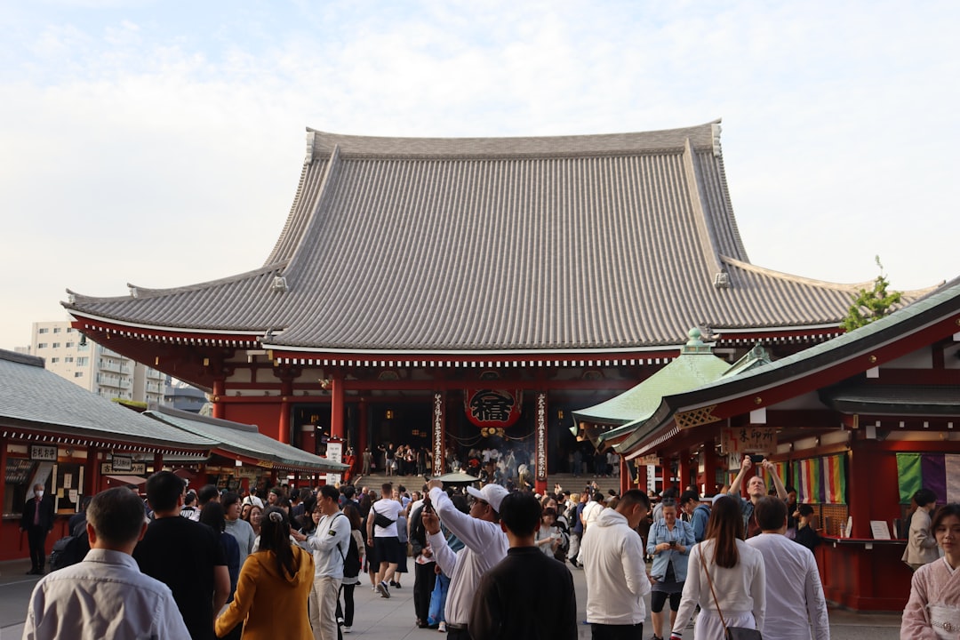A large crowd of attendees moving through exhibition halls at Comic Market in Tokyo