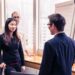 A foreign founder shaking hands with a Tokyo angel investor after a successful first meeting in a modern office