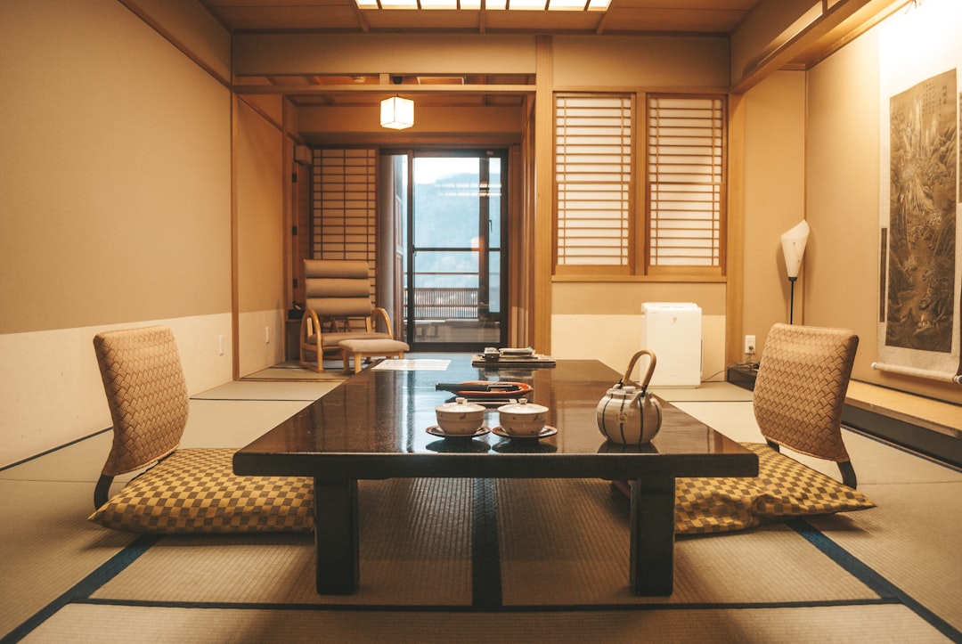 A couple relaxes in a tatami room at a Tokyo ryokan booked for the Obon season kaiseki and lantern experience.