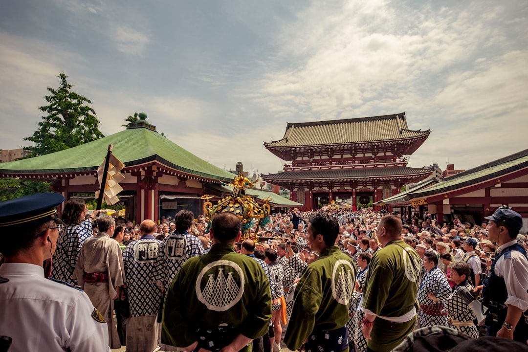 An international couple participates in a Tokyo neighbourhood festival, connecting with local residents during Obon season.