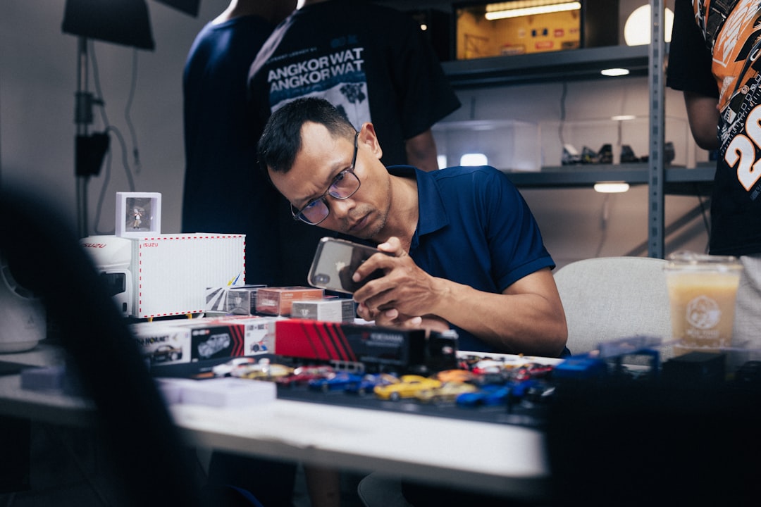 A skilled volunteer repairs a small electronic device at a Tokyo repair café, demonstrating hands-on sustainability.