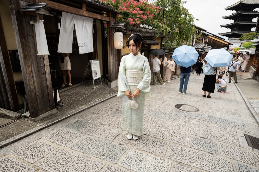 A textile artisan in Japan handles a piece of traditional breathable Japanese fabrics woven from hemp and ramie fibers
