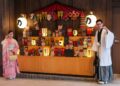 A kimono-dressed host welcomes arriving guests at a Kagurazaka ryokan entrance during the summer Obon season in Tokyo.