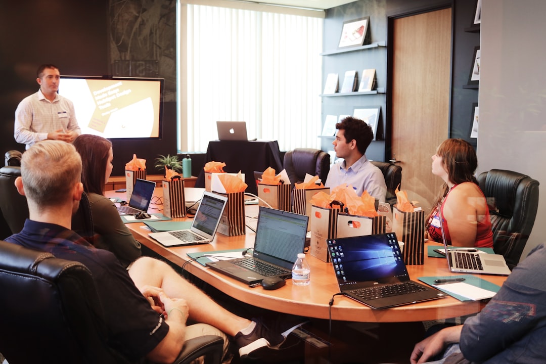 A startup founder delivering a pitch to a Tokyo angel investor panel in a Shibuya co-working space