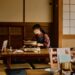 A woman cooking an izakaya menu in Tokyo while navigating a gluten-free izakaya dinner