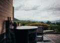 woman-relaxing-private-onsen-bath-unsplash - TOKYOwebzine A woman resting in a private onsen suite, reflecting the serene standard of Tokyo wellness membership clubs
