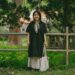 A woman wearing pieces from her capsule wardrobe made of natural-dye Japanese textiles