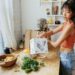 asian-woman-carrying-kitchen-compost-bag-unsplash - TOKYOwebzine A resident carries a bag of food scraps to a community composting drop-off point in a Tokyo ward