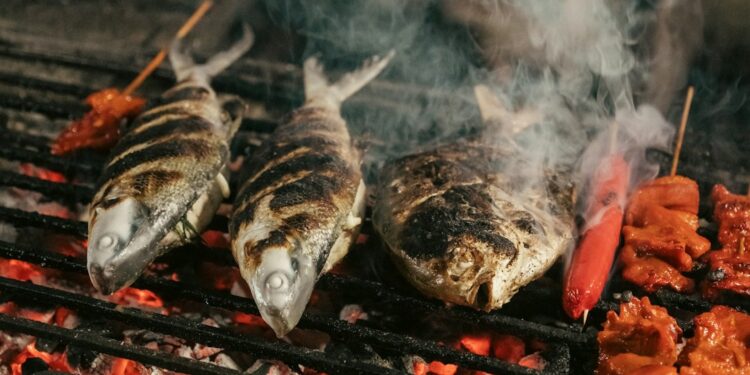 Sanma season in Tokyo where to eat it fresh photo 1 - TOKYOwebzine Chef grilling fish during Tokyo's sanma season at an autumn festival