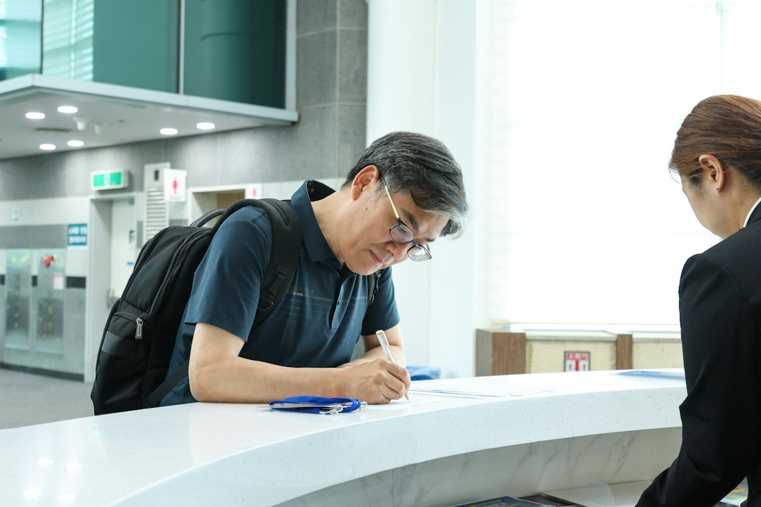 Tokyo bank clerk helping a foreign founder open a business account