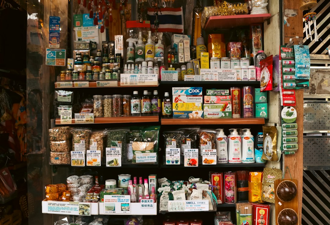 Shopper choosing dry skin products at a Tokyo drugstore