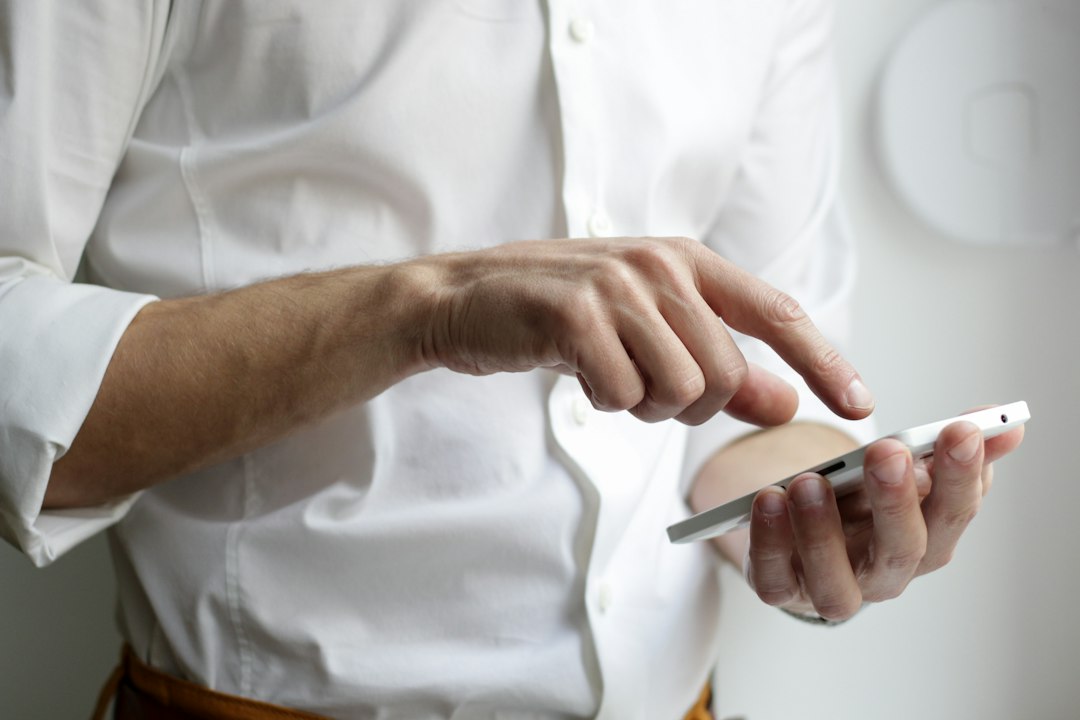 Foreign business owner checking a business account app in a Tokyo office