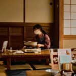 A woman cooking an izakaya menu in Tokyo while navigating a gluten-free izakaya dinner