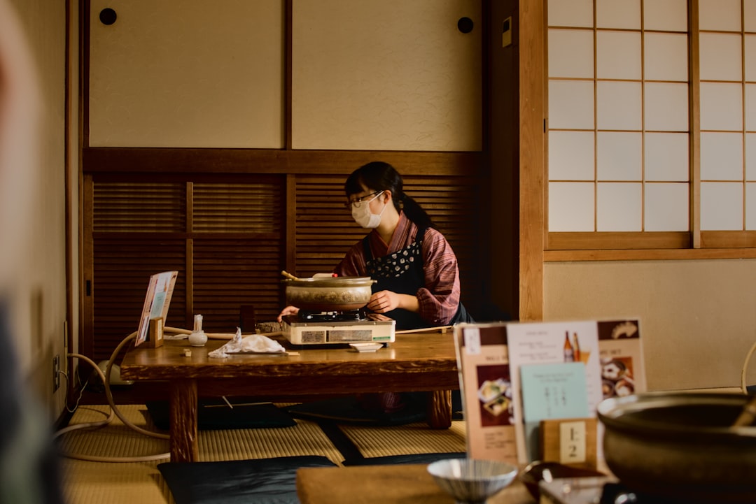 A woman cooking an izakaya menu in Tokyo while navigating a gluten-free izakaya dinner